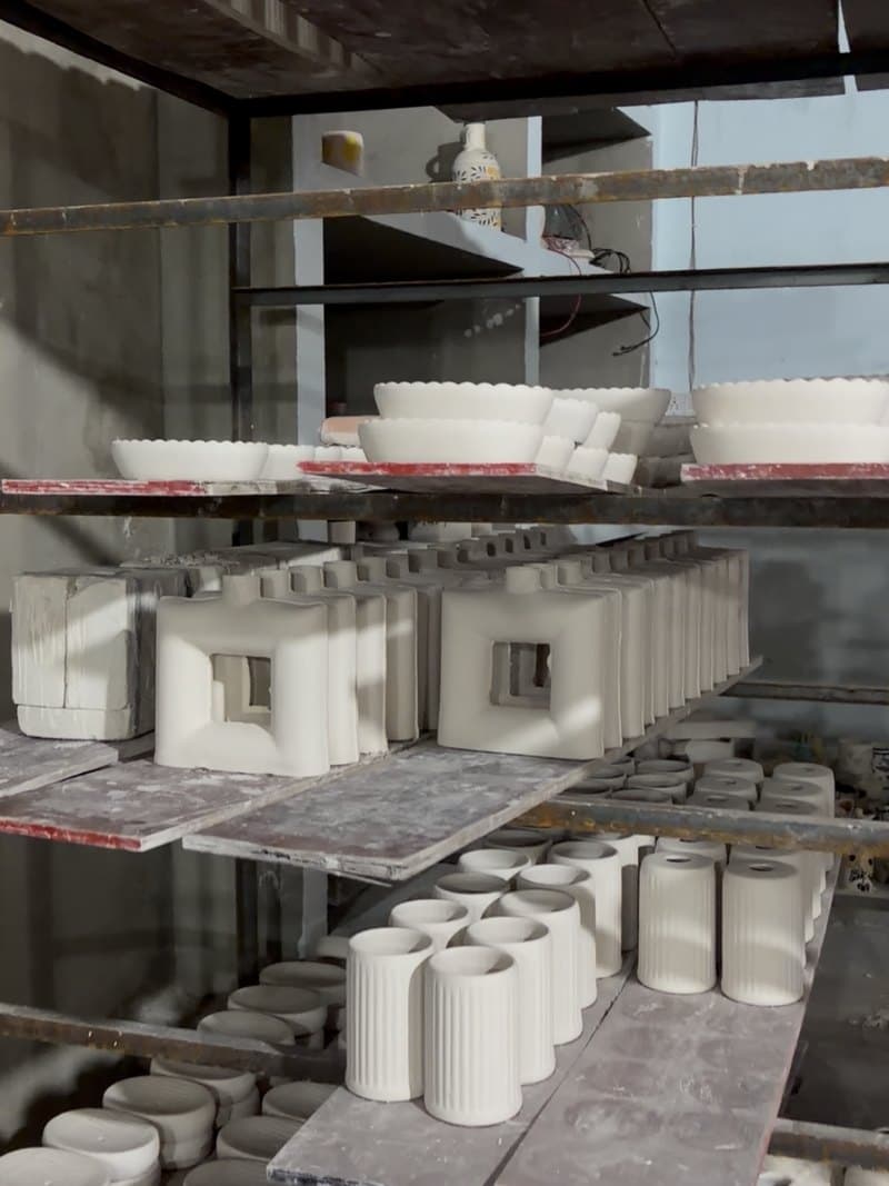 Ceramic pieces in progress on the drying racks in the Khurja unit