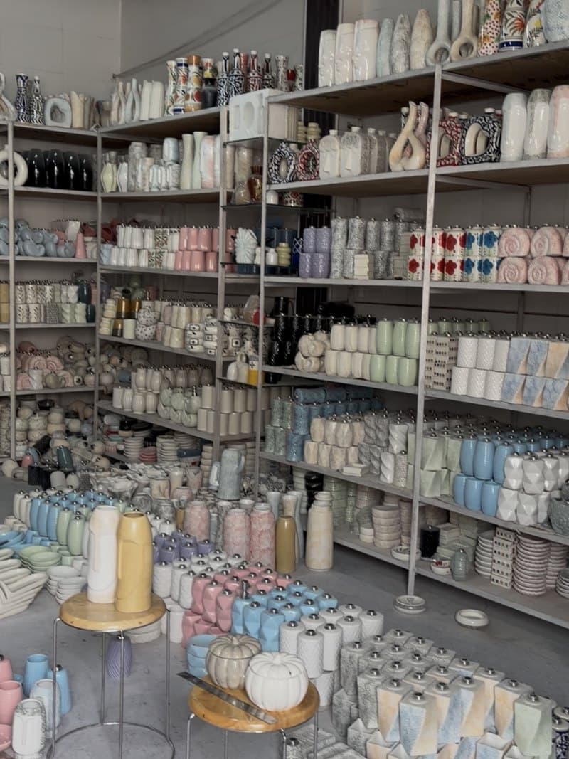 Shelves of finished ceramic stock in the Home Decoratives unit in Khurja